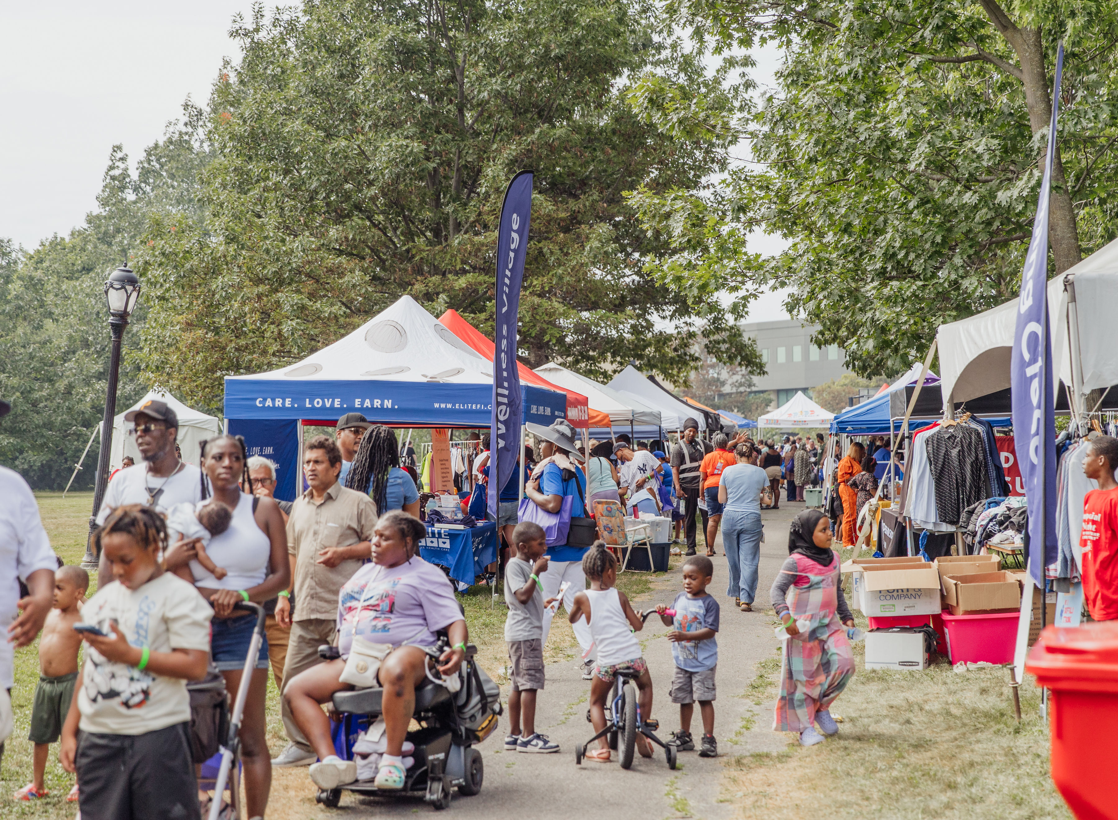 Volunteers and families at a Trusted Gives community day event in Buffalo
